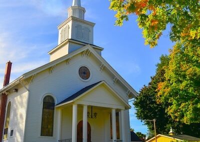 A white steepled Church sanctuary